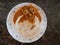 Delicious dish  Rice rotti with Chicken curry in a bowl closeup view