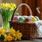 Delicious Easter cake in a basket, colorful eggs and yellow daffodils flowers