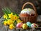Delicious Easter cake, colorful eggs and yellow daffodils flowers on a wooden table