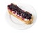 Delicious eclair with berry jam.