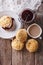 Delicious English scones with jam and tea. vertical top view