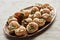 Delicious escargots on plate on stone background.