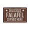 Delicious falafel served here grungy vintage metal web sign isolated