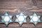 Delicious festive Hanukkah cookies for celebrating on a wooden background. Closeup.