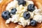 Delicious filling of homemade cheese, blueberries and honey on pancake