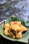 delicious flour fried chicken served with banana leaves