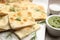 Delicious focaccia bread on marble board, closeup