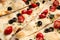 Delicious focaccia bread with olives and tomatoes, closeup