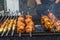 Delicious food cooked over an open fire offered at a street food fair, event, festival.