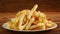 Delicious french fries in a plate on top of table