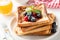 Delicious french toast with berries and honey