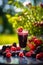 Delicious fresh berries smoothie served outside on a sunny day. Healthy fitness snack.