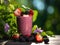 Delicious fresh berries smoothie served outside on a sunny day. Healthy fitness snack.