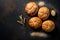 Delicious fresh bread buns, wheat ears and flour on black chalkboard background, top view, flat lay, copy space