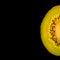 Delicious fresh green and golden kiwifruit slice isolated at black background