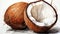 Delicious fresh ripe coconut split into two parts on a white