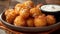 Delicious fried cheese balls with dipping sauce