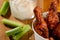 Delicious fried chicken drumsticks. Celery slices and mayonnaise addition