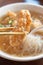 Delicious fried narrow-barred Spanish mackerel fish fillet with rice and noodles in thick soup in Taiwan