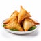 Delicious Fried Samosas On A White Background