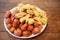Delicious fried various meat ball. Mix asian seafood Appetizers dish isolated on brown wooden table