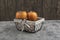 Delicious fuyu persimmon fruits placed in basket on marble surface