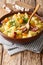Delicious German potato vegetable soup with sausages in a bowl c