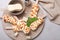 Delicious glazed ice cream bars, chocolate and mint on light grey marble table, flat lay