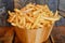 Delicious Golden French Fries in a Wooden Bowl on Rustic Background Fast Food Concept