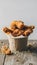 Delicious golden fried chicken in paper cup on wooden surface Mouthwatering treat