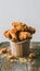 Delicious golden fried chicken in paper cup on wooden surface Mouthwatering treat