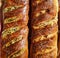 Delicious good looking homemade bread stuffed pastry with golden crust and seeds for a healthy carbohydrate meal or snack