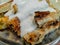 Delicious good looking served Bosnian borek pie with meat and topped with cream, a delicious traditional meal on the Balkans and