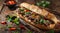 Delicious gourmet beef sandwich on rustic wooden table