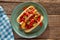 Delicious Gourmet Hotdogs with Fresh Tomato, Crispy Onion, and a Tangy Chili Twist