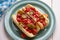 Delicious Gourmet Hotdogs with Fresh Tomato, Crispy Onion, and a Tangy Chili Twist