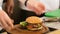 A delicious gourmet meal is being given the finishing touches by the chef in a restaurant