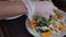 A delicious gourmet meal is being given the finishing touches by the chef in a restaurant or hotel kitchen