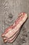Delicious Gourmet Meaty Pork Belly Bacon Rashers Set On Old Knotted Wooden Table Surface