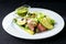 Delicious green meat salad with roasted juicy steak, avocado and