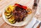 Delicious grilled beef steak with potatoes and vegetables