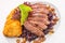 Delicious grilled duck breast with cabbage and potato dumpling on white plate