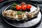 Delicious grilled pollock with fresh thyme and tomatoes. Black background. Top view