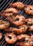 Delicious grilled shrimp meal on grill with a flame