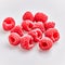 Delicious group of raspberries over isolated white background