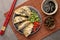 Delicious gyoza (asian dumplings) served on gray table