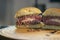 Delicious halved jucy lucy burger stuffed with cheese