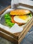 Delicious hamburger with eggs, lettuce and salmon fish