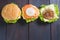 Delicious hamburger on wooden background, shot from upper view
