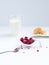 Delicious healthy breakfast with coconut cookies, rasberries and milk in glass as a background.